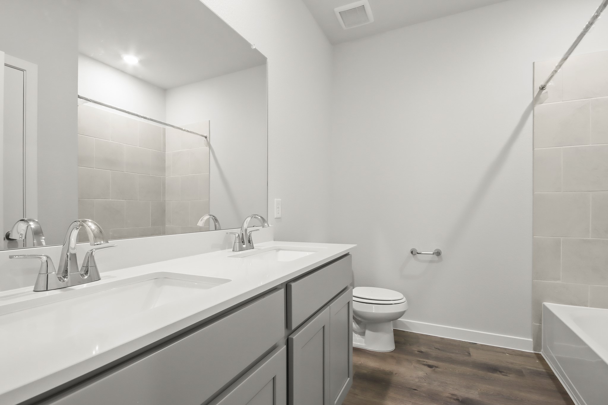 225 Spring Drive Hockley, TX 77447 - Photo 13 of 24 a bathroom with a sink a toilet and a mirror