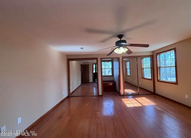 a bathroom with a sink mirror vanity and toilet