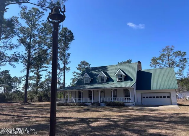 a front view of a house with a ocean view