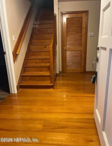 a view of a livingroom with kitchen and furniture