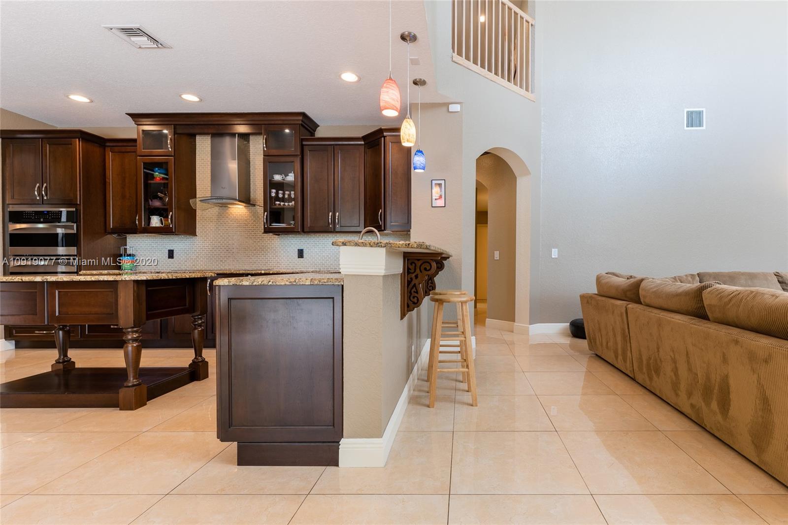 12358 St Simon Drive Boca Raton, FL 33428 - Photo 13 of 89 a kitchen with a sink a counter top space appliances and cabinets