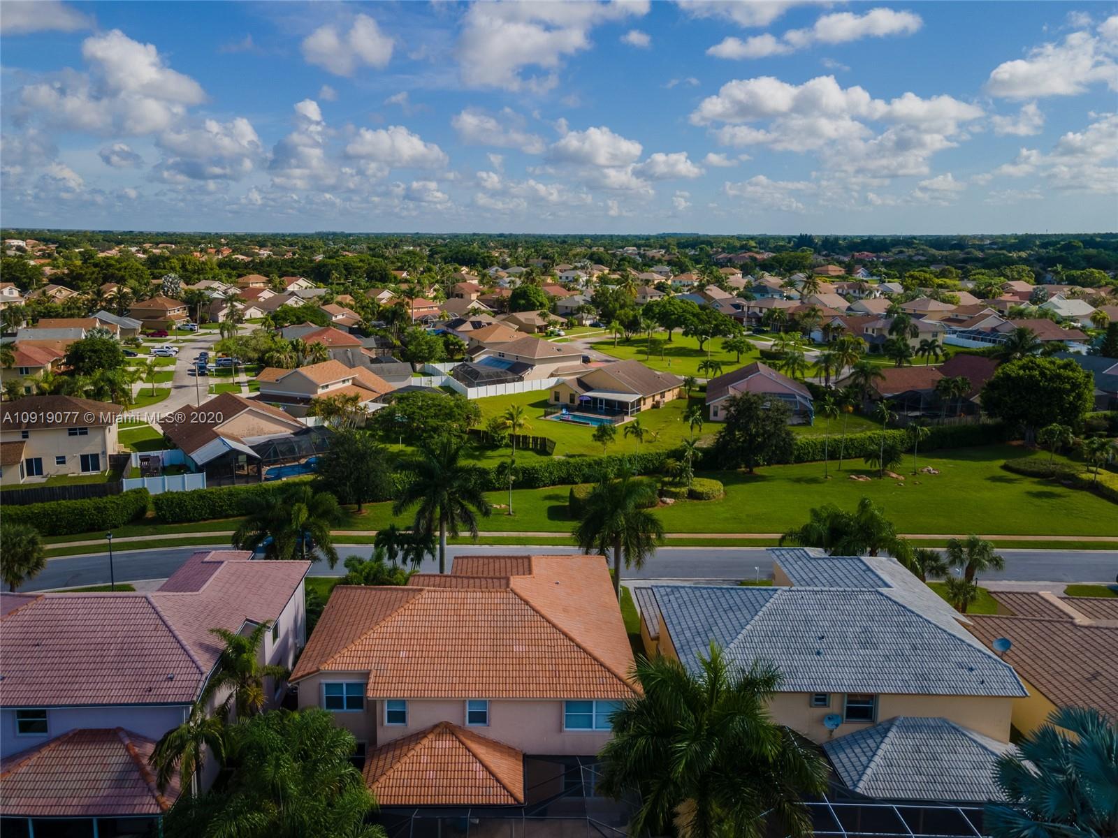 12358 St Simon Drive Boca Raton, FL 33428 - Photo 2 of 89 an aerial view of a house with a garden