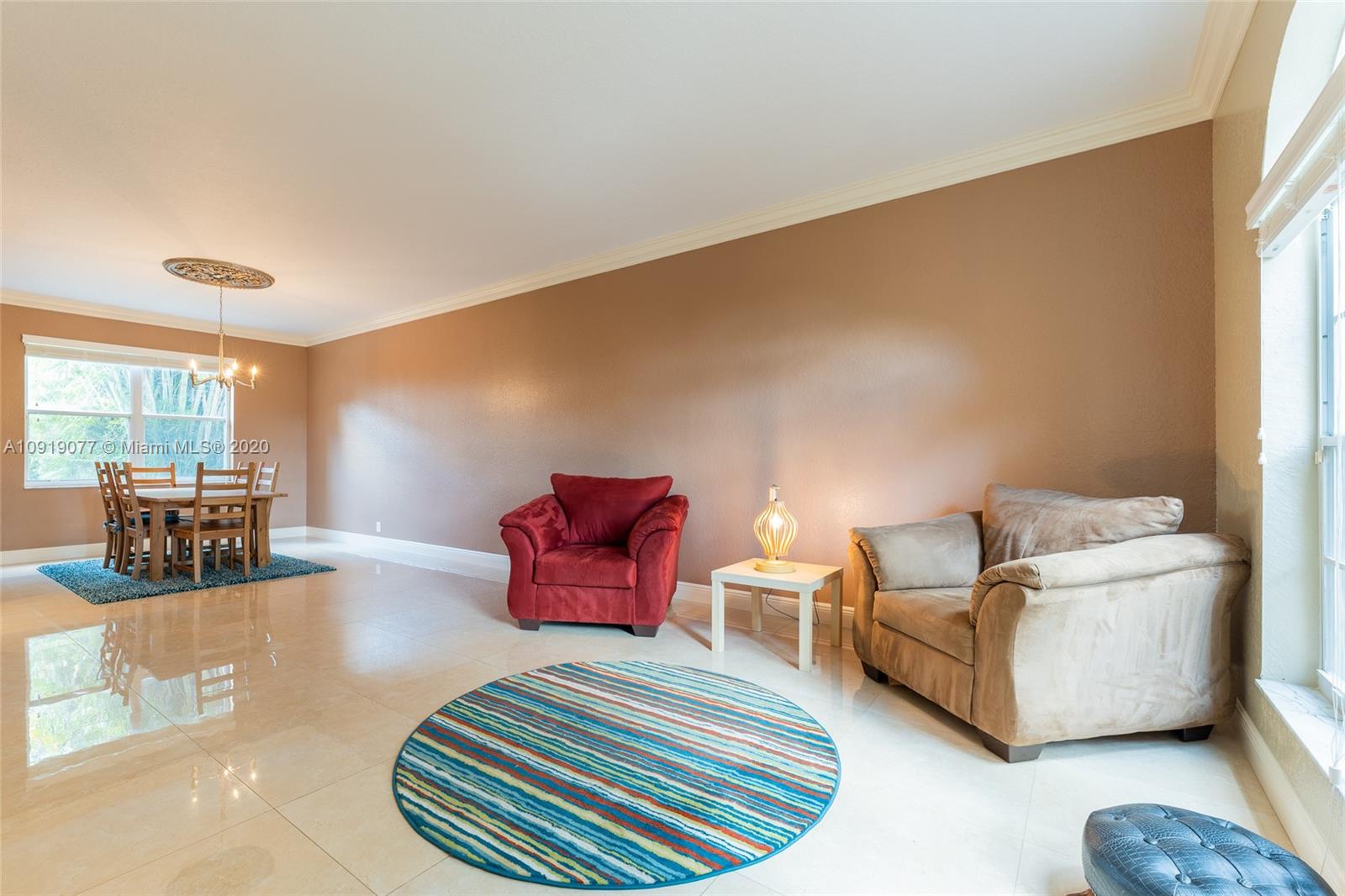 12358 St Simon Drive Boca Raton, FL 33428 - Photo 21 of 89 a living room with furniture and a large window
