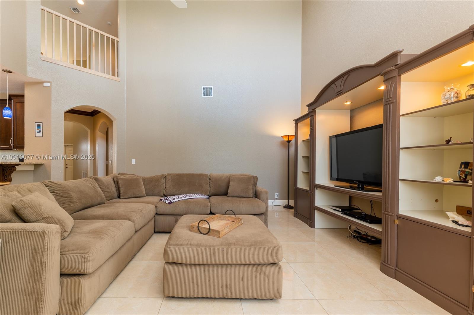 12358 St Simon Drive Boca Raton, FL 33428 - Photo 27 of 89 a living room with furniture and a flat screen tv