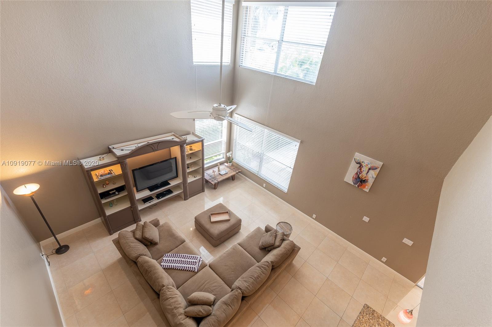 12358 St Simon Drive Boca Raton, FL 33428 - Photo 35 of 89 a living room with furniture and a window