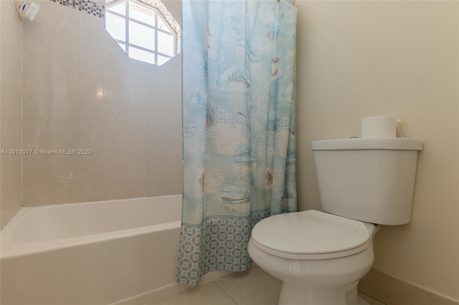 12358 St Simon Drive Boca Raton, FL 33428 - Photo 53 of 89 a bathroom with a toilet and a bathtub