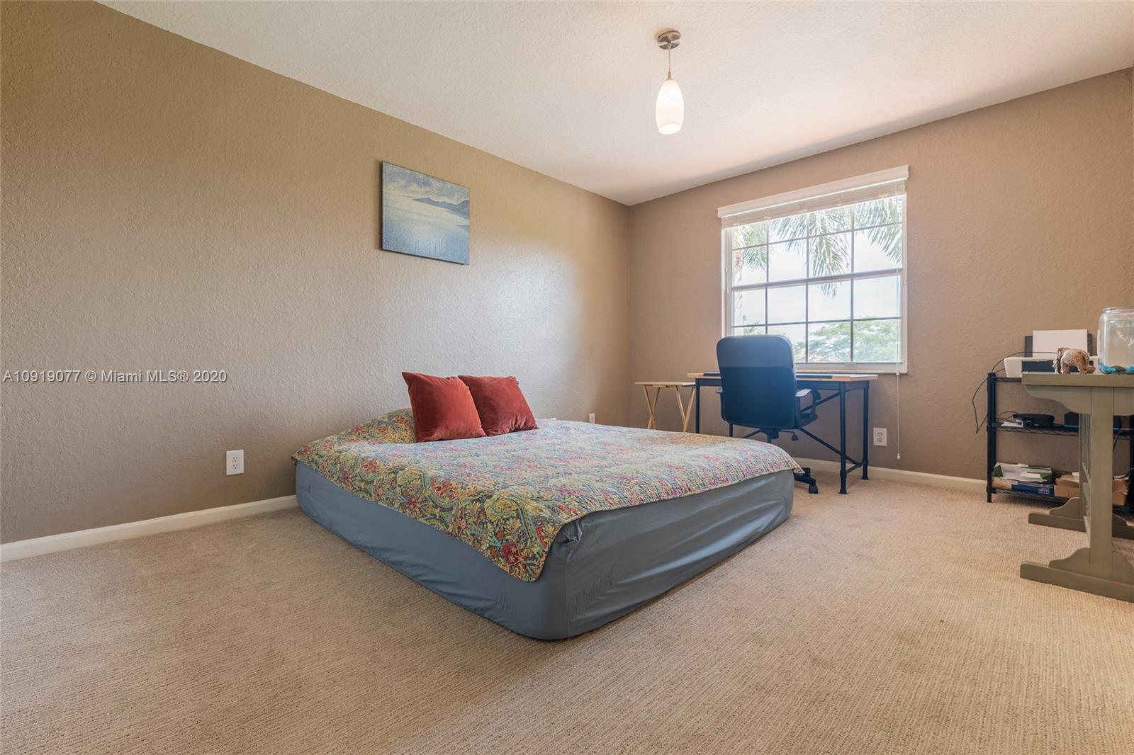 12358 St Simon Drive Boca Raton, FL 33428 - Photo 54 of 89 a bedroom with a bed chair and window