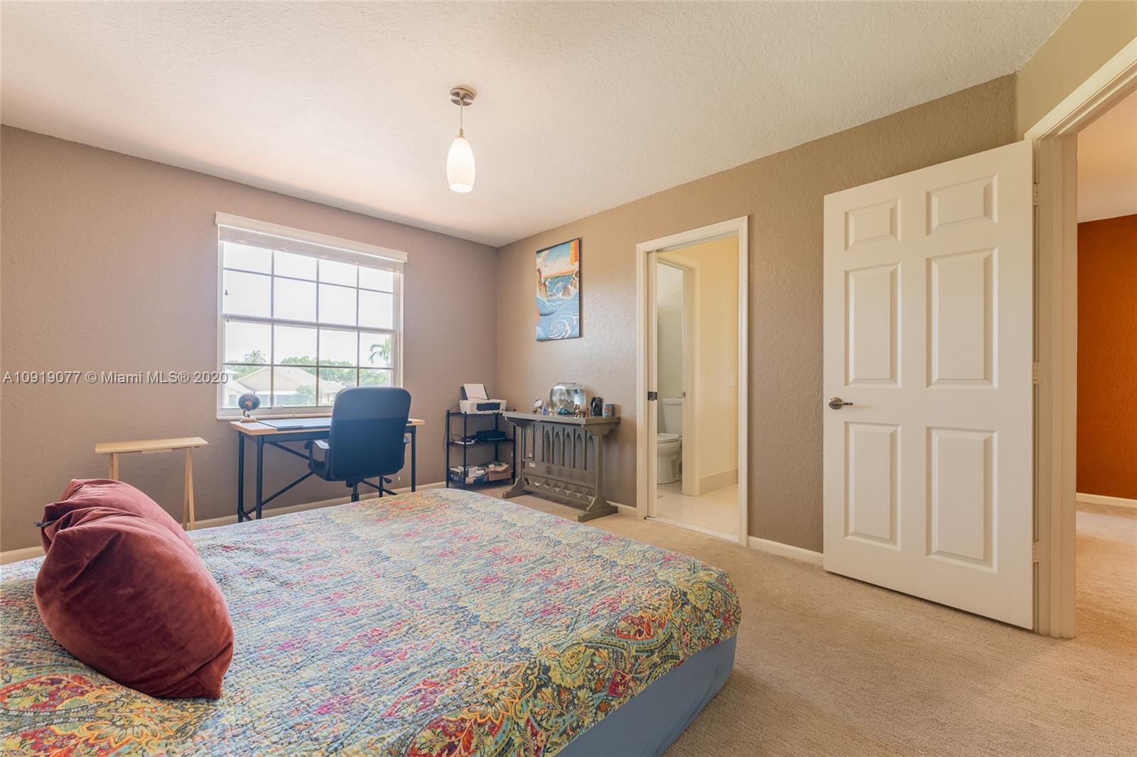 12358 St Simon Drive Boca Raton, FL 33428 - Photo 56 of 89 a bed room with a bed a chair and potted plant