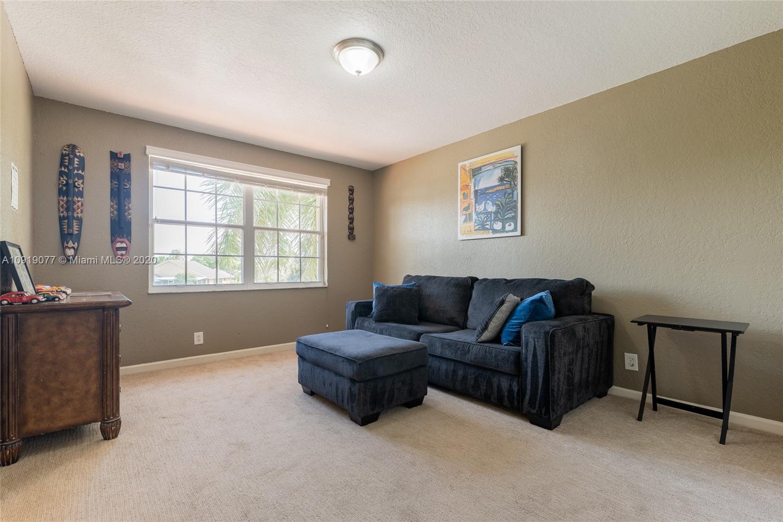 12358 St Simon Drive Boca Raton, FL 33428 - Photo 60 of 89 a living room with furniture and a window