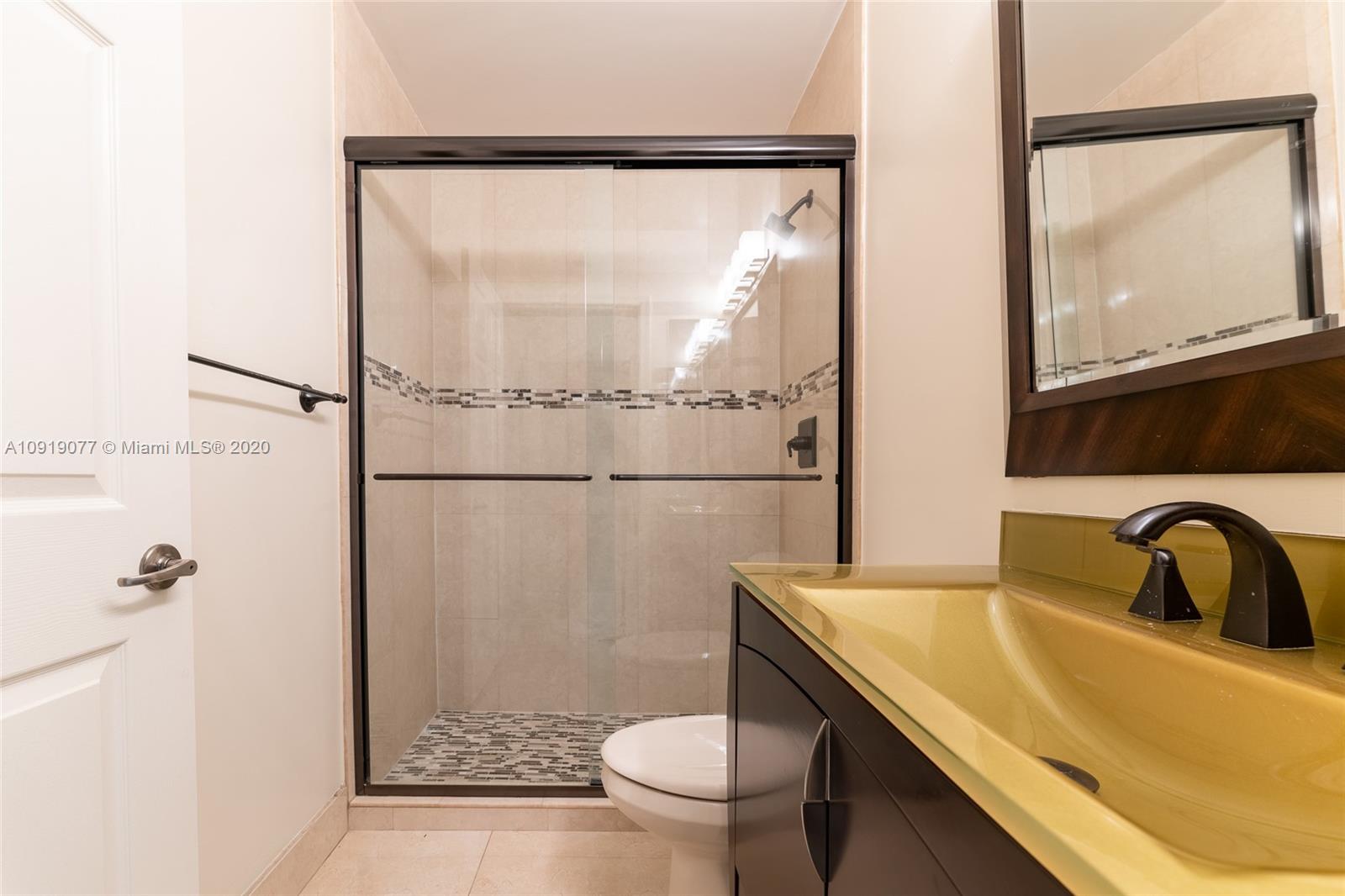 12358 St Simon Drive Boca Raton, FL 33428 - Photo 67 of 89 a bathroom with a sink toilet and shower