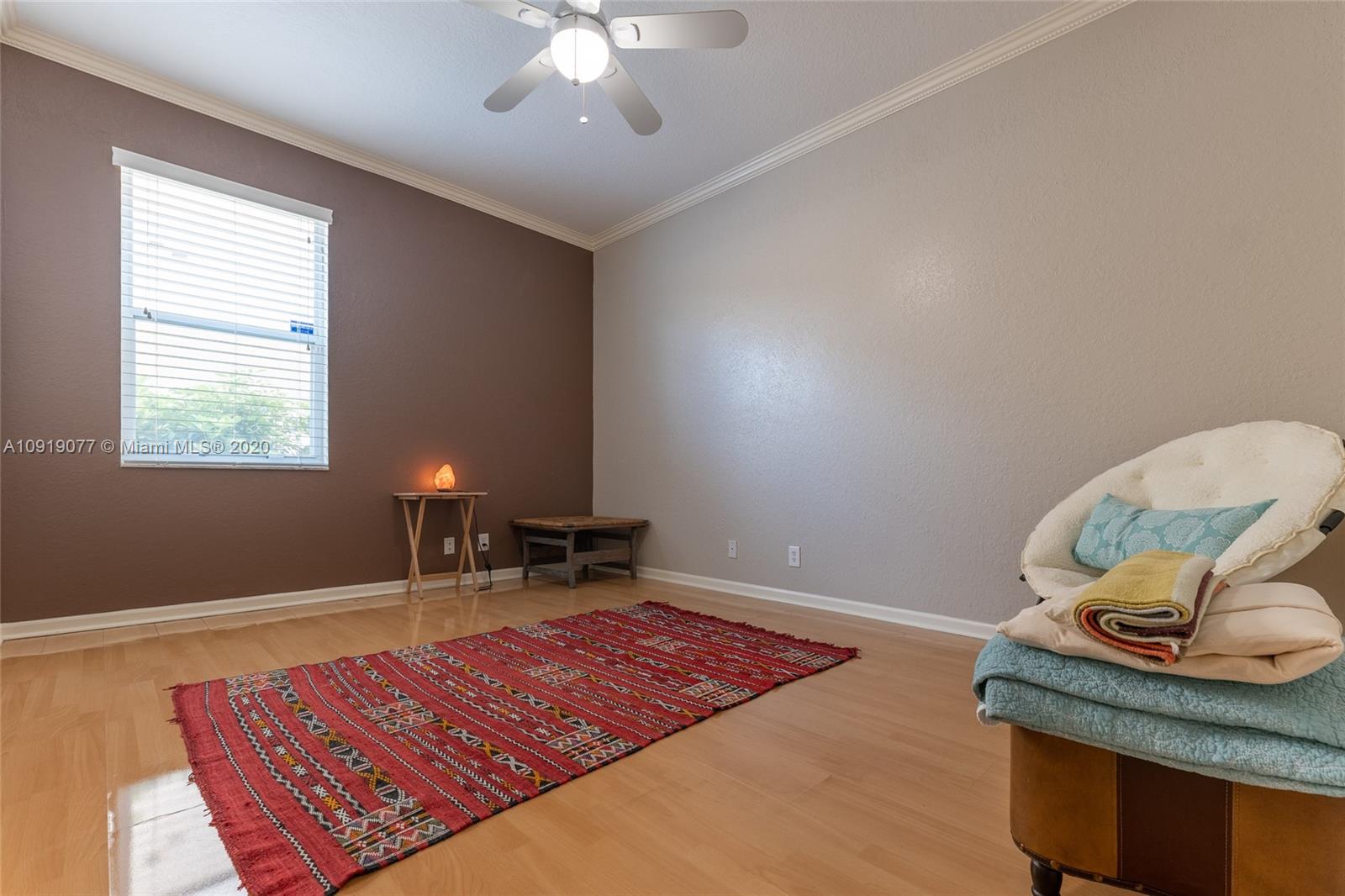 12358 St Simon Drive Boca Raton, FL 33428 - Photo 68 of 89 a living room with furniture rug and window
