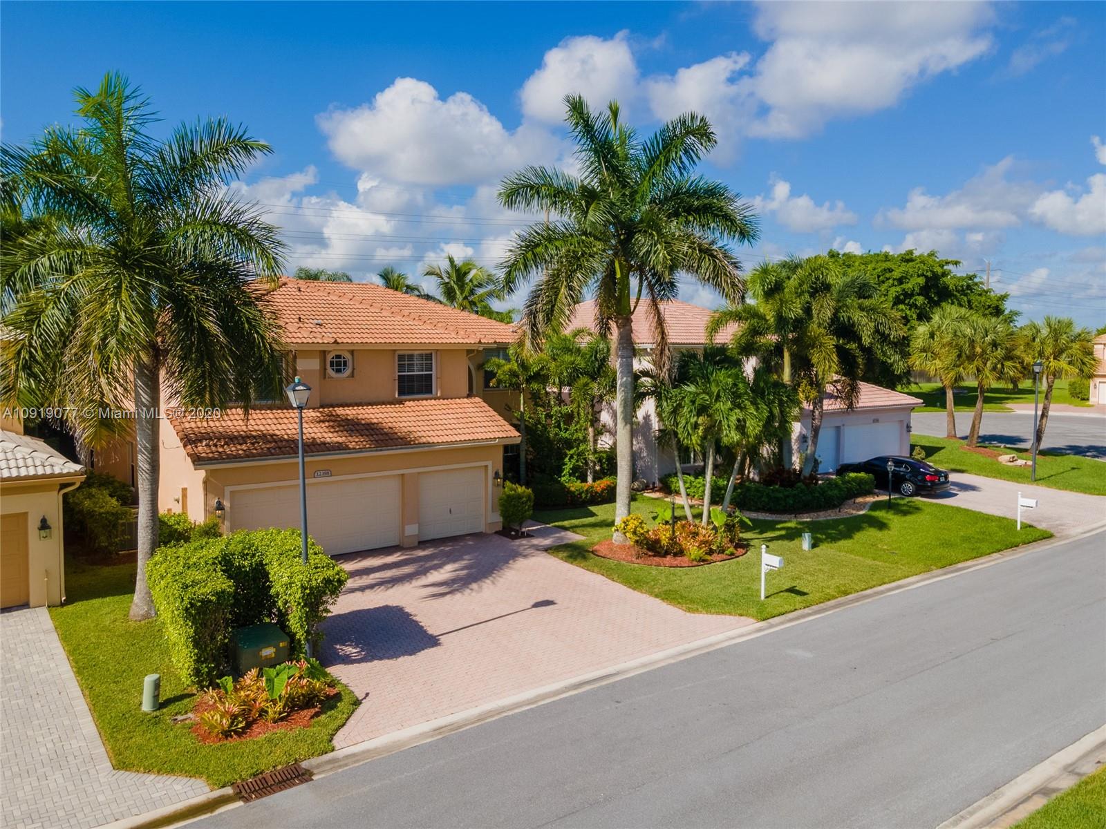 12358 St Simon Drive Boca Raton, FL 33428 - Photo 77 of 89 a view of a house with backyard and sitting area
