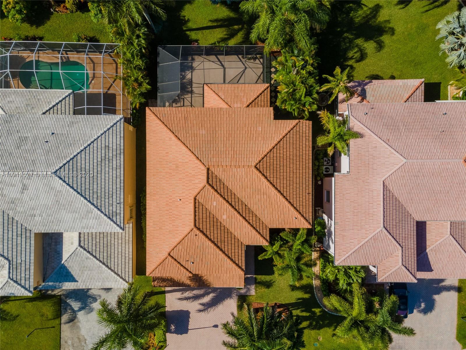 12358 St Simon Drive Boca Raton, FL 33428 - Photo 79 of 89 an aerial view of a house with a yard and potted plants