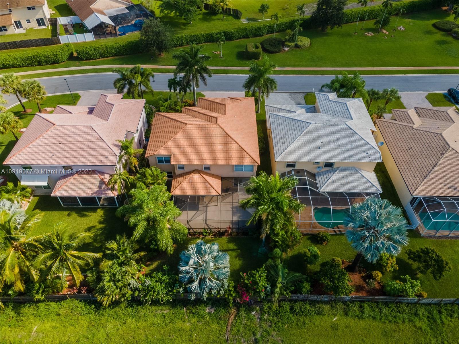 12358 St Simon Drive Boca Raton, FL 33428 - Photo 80 of 89 an aerial view of house with yard swimming pool and outdoor seating