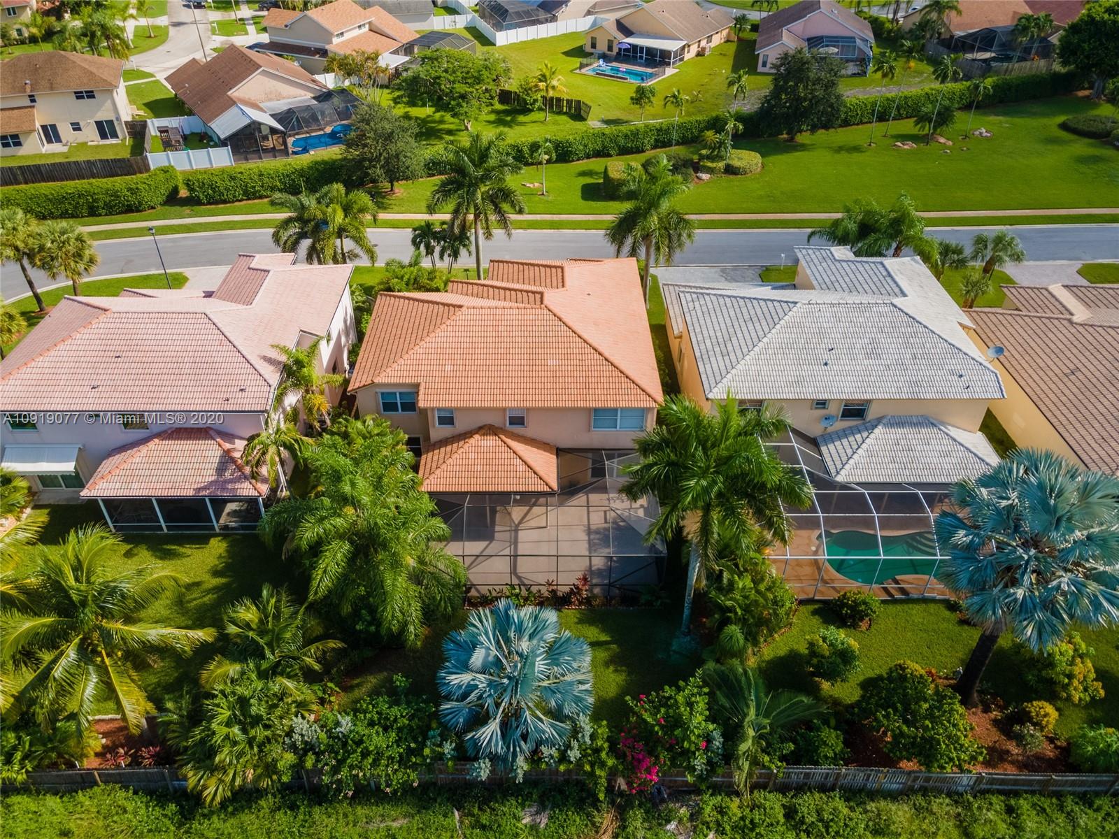 12358 St Simon Drive Boca Raton, FL 33428 - Photo 81 of 89 an aerial view of a house with a garden