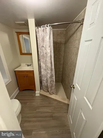 a view of bathroom with sink toilet and tub