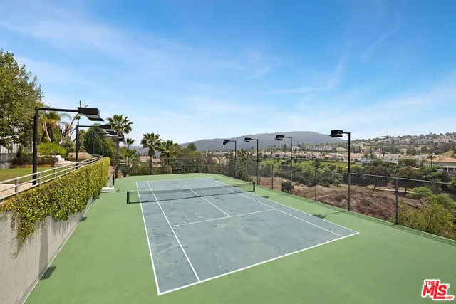 a view of an outdoor space and tennis court