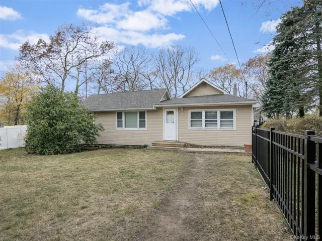 a front view of a house with yard