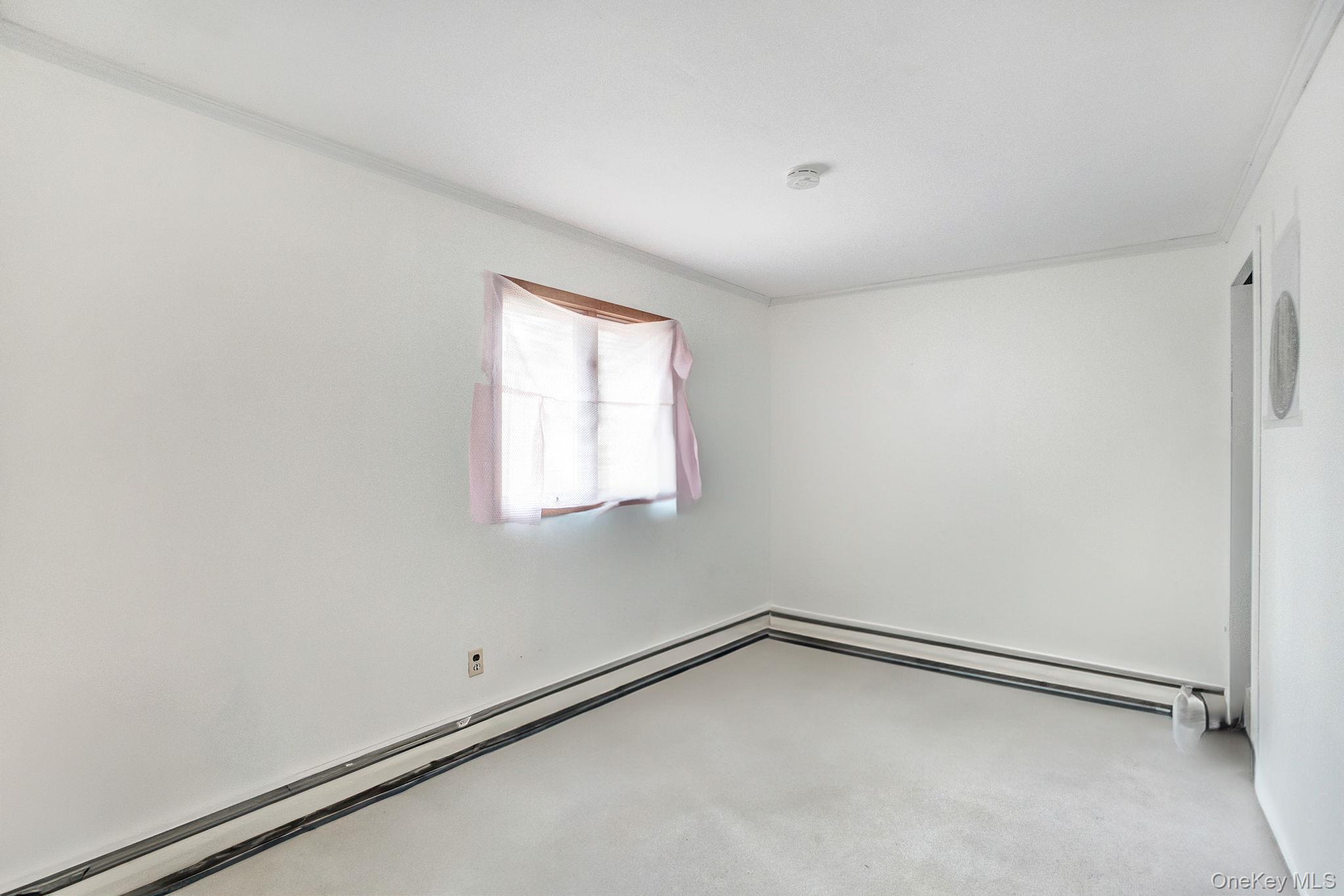 8 Evergreen Road Rocky Point, NY 11778 - Photo 15 of 20 a view of an empty room