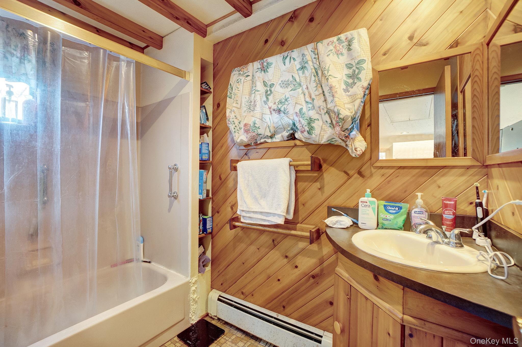 8 Evergreen Road Rocky Point, NY 11778 - Photo 16 of 20 a bathroom with a granite countertop sink toilet and shower