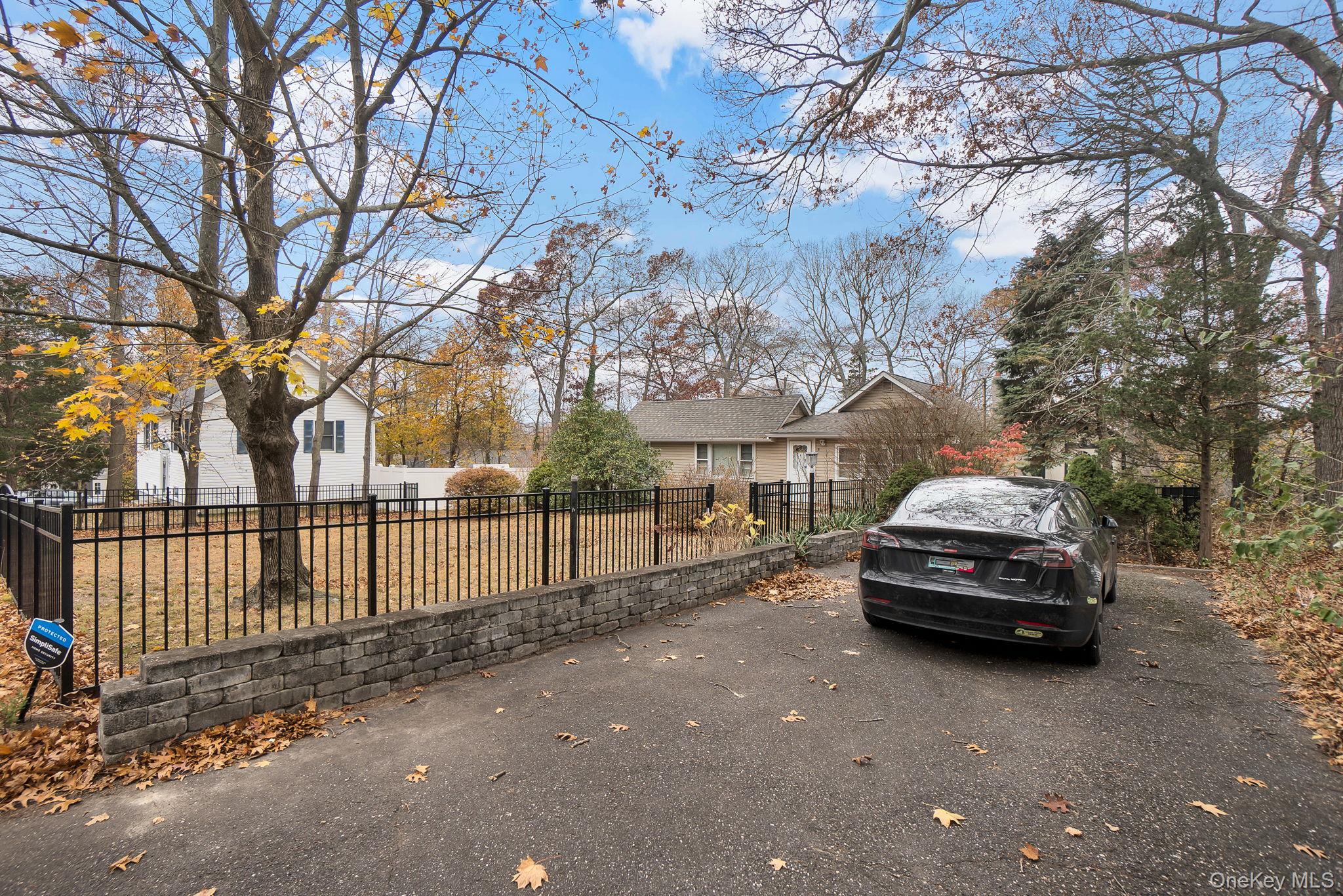 8 Evergreen Road Rocky Point, NY 11778 - Photo 20 of 20 a car parked on the side of a street