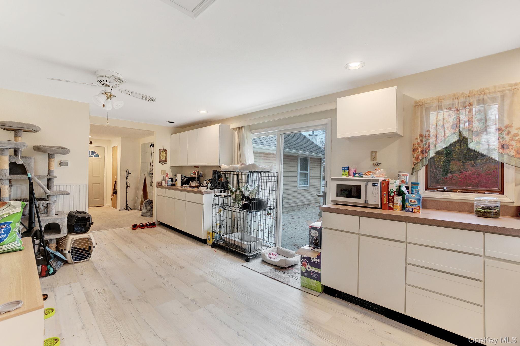 8 Evergreen Road Rocky Point, NY 11778 - Photo 6 of 20 a kitchen that has a lot of cabinets and appliances