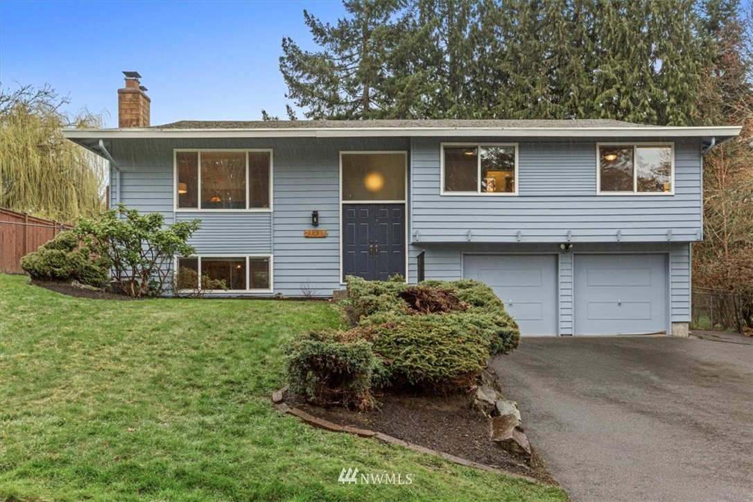 21918 7th Place West Bothell, WA 98021 - Photo 1 of 25 a front view of a house with garden