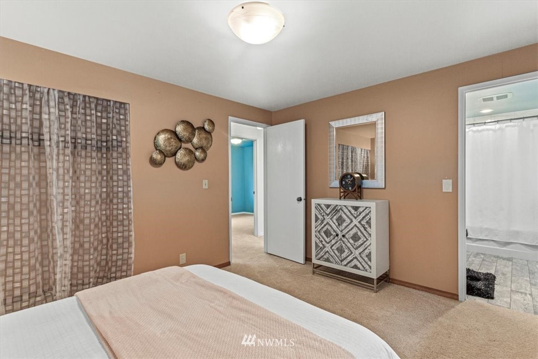 21918 7th Place West Bothell, WA 98021 - Photo 15 of 25 a bedroom with a bed and a view of bathroom