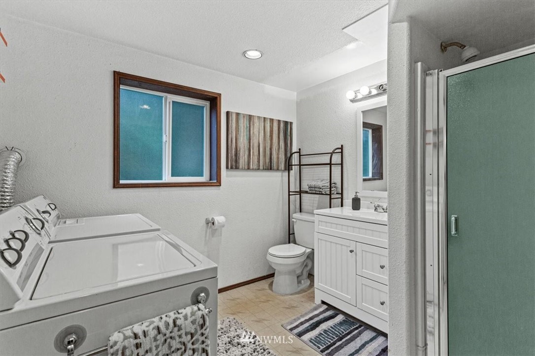 21918 7th Place West Bothell, WA 98021 - Photo 18 of 25 a bathroom with a sink toilet and shower