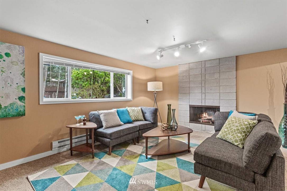 21918 7th Place West Bothell, WA 98021 - Photo 19 of 25 a living room with furniture and a fireplace