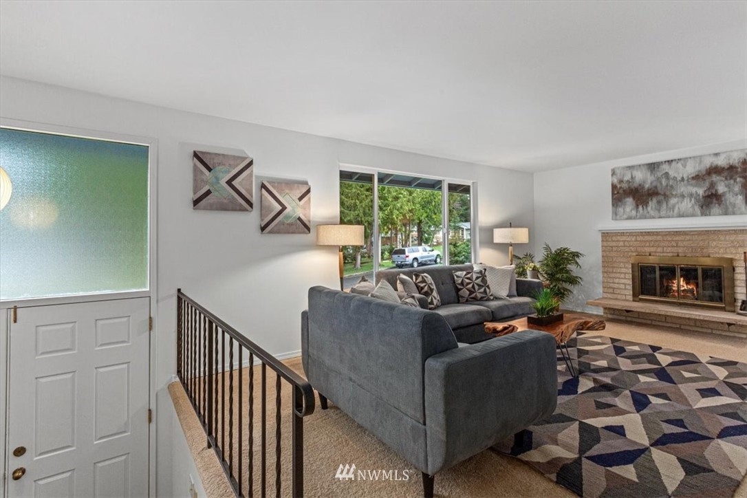 21918 7th Place West Bothell, WA 98021 - Photo 2 of 25 a living room with furniture and a fireplace