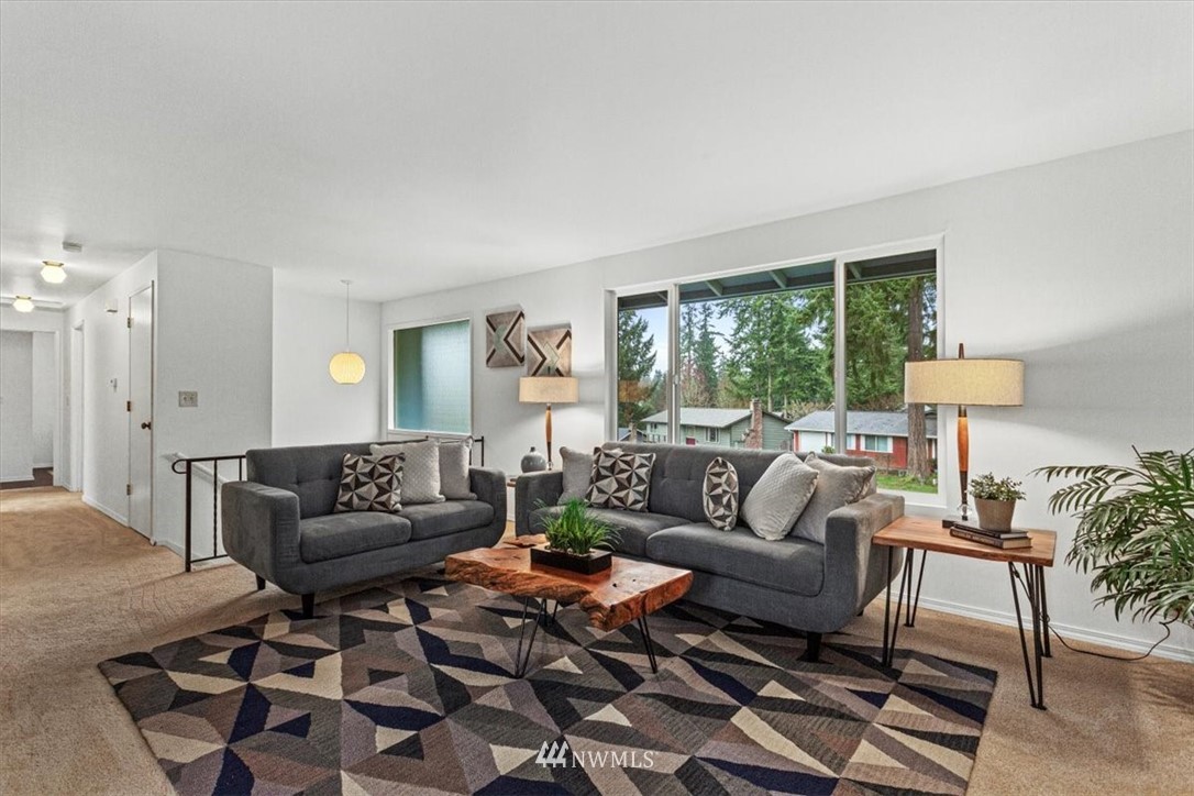 21918 7th Place West Bothell, WA 98021 - Photo 3 of 25 a living room with furniture and a large window