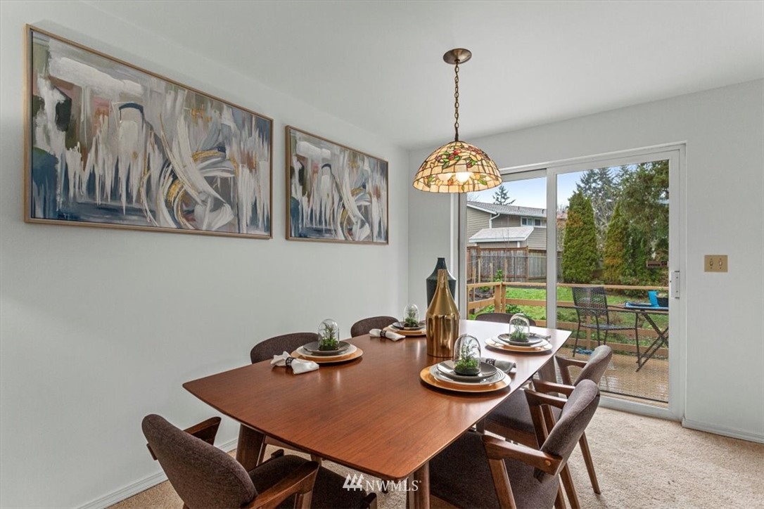 21918 7th Place West Bothell, WA 98021 - Photo 6 of 25 a view of a dining room filled with furniture window and chandelier