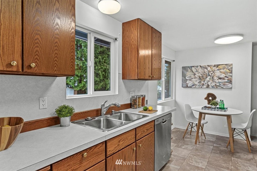 21918 7th Place West Bothell, WA 98021 - Photo 7 of 25 a kitchen with a sink cabinets and window
