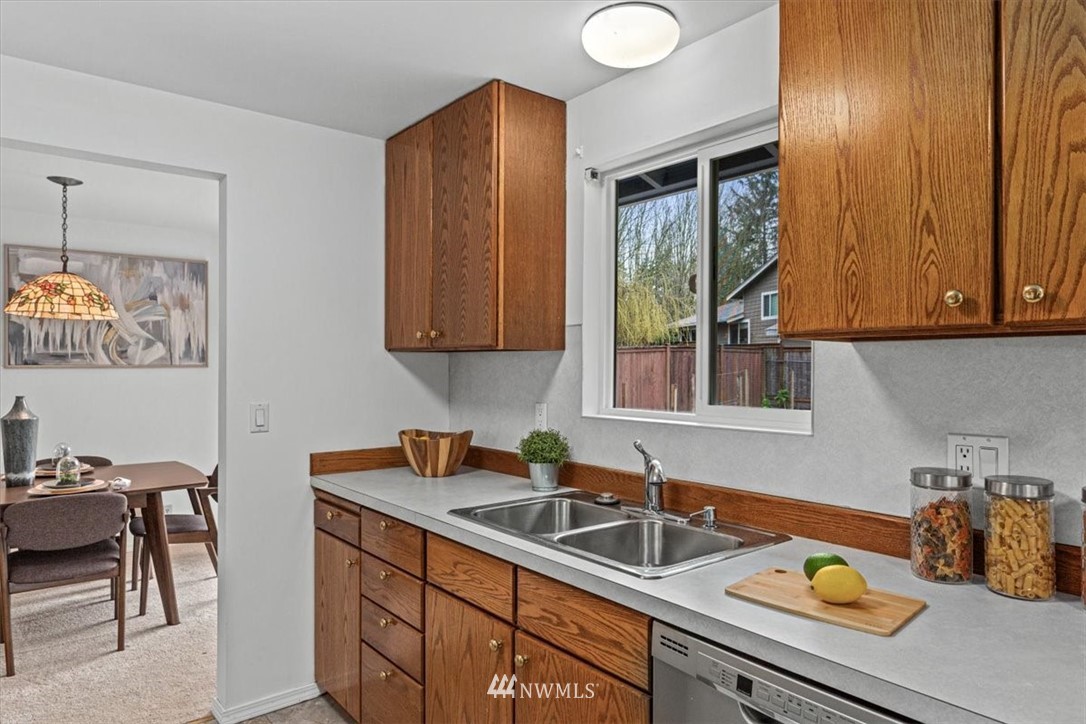 21918 7th Place West Bothell, WA 98021 - Photo 9 of 25 a kitchen with a sink cabinets and window