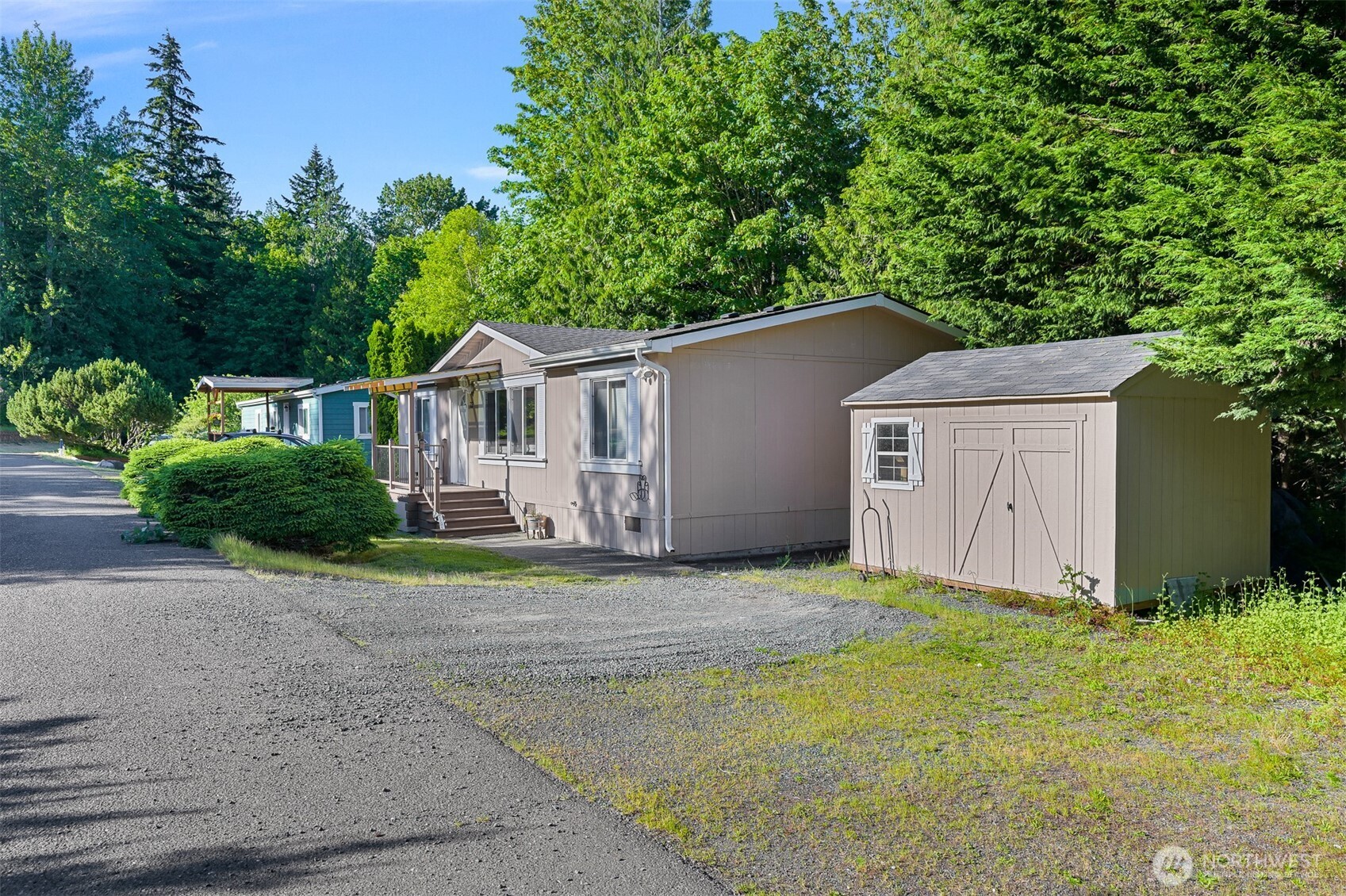 2174 Yew Street Road, Unit 22 Bellingham, WA 98229 - Photo 3 of 36 a house with trees in the background