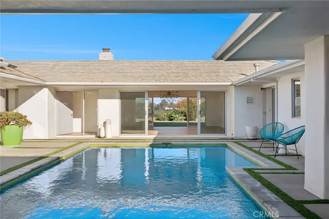 a view of a house with sitting area and furniture