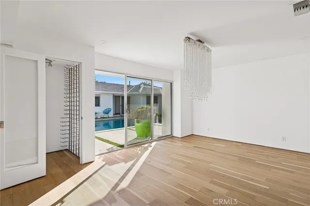 a view of an empty room with glass door