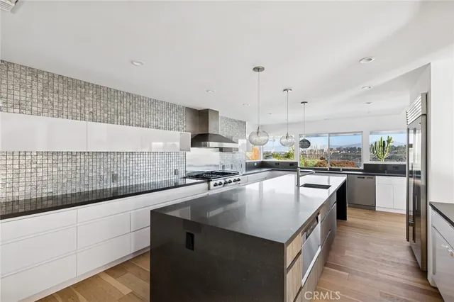 a large kitchen with granite countertop lots of counter top space