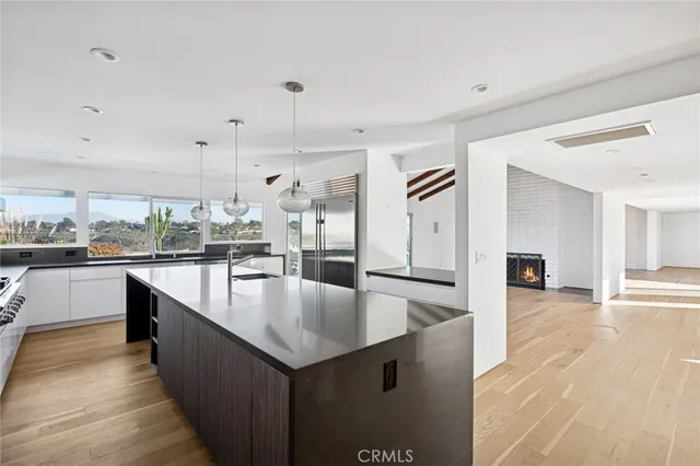 a large kitchen with stainless steel appliances lots of counter top space