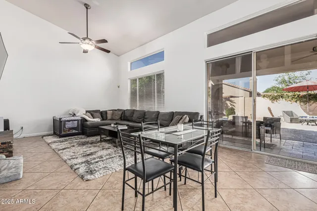 a patio with a table and chairs