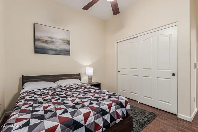 a bedroom with a bed and a window