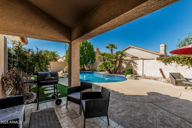 a view of a backyard with sitting area