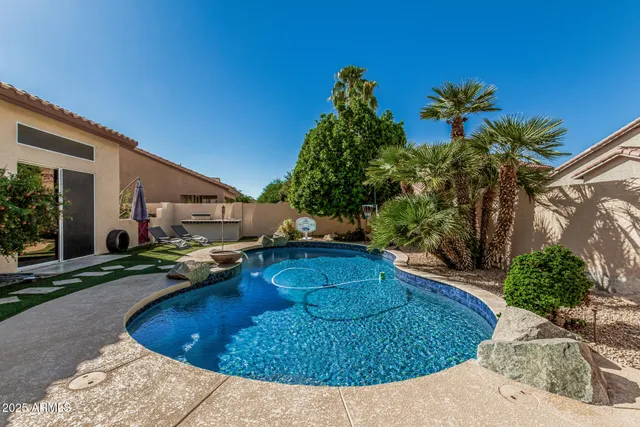 a view of a swimming pool with a patio