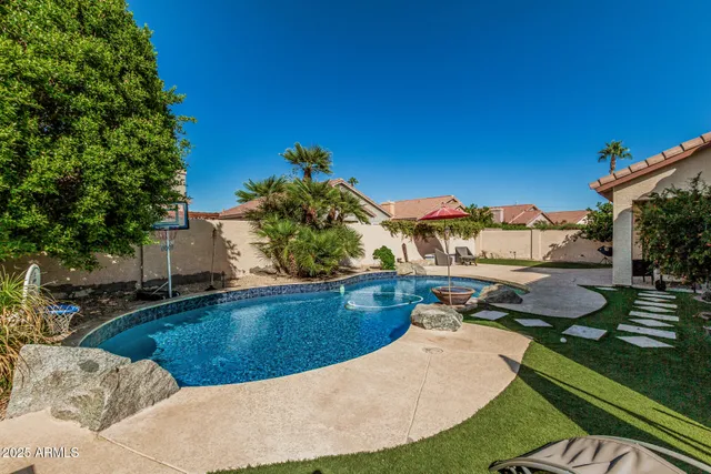 a view of a swimming pool with a patio