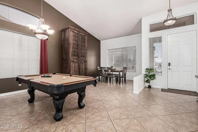 a room with furniture a table and potted plants