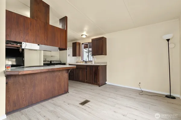 a kitchen with stainless steel appliances granite countertop a sink counter space and cabinets