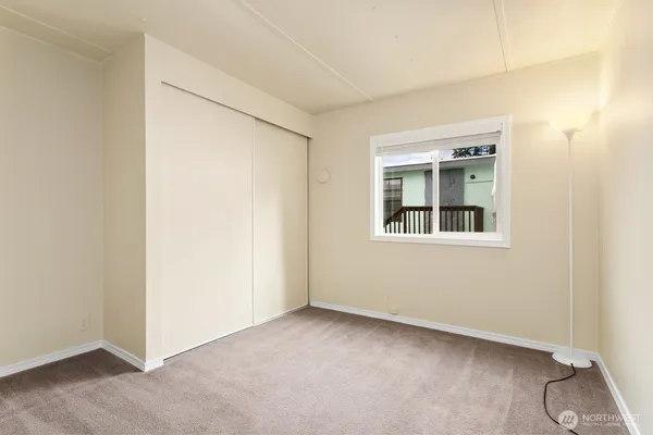 a view of an empty room with windows
