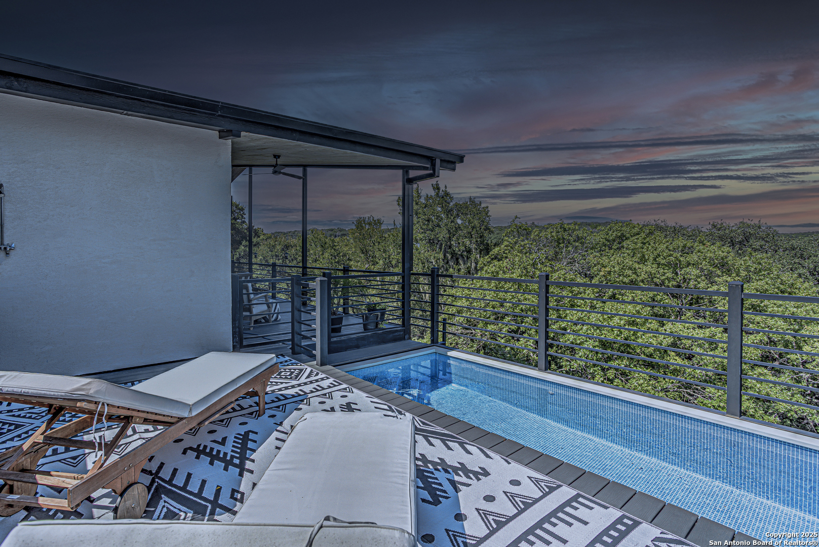 2705 Campestres Spring Branch, TX 78070 - Photo 1 of 35 a bed sitting in a balcony next to a window