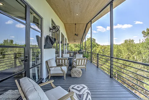a view of balcony with chairs